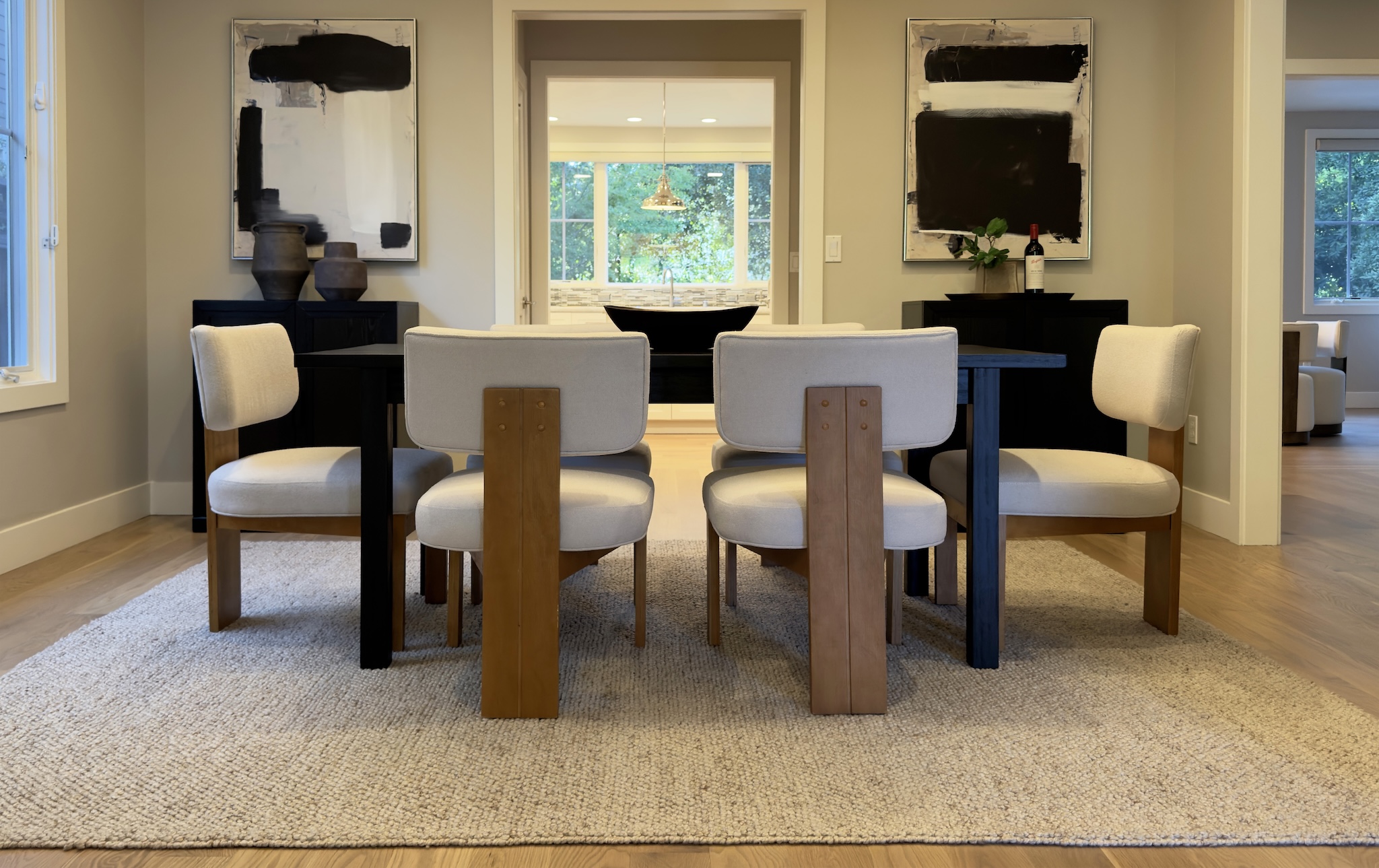 Dining room with wood table and upholstered chairs