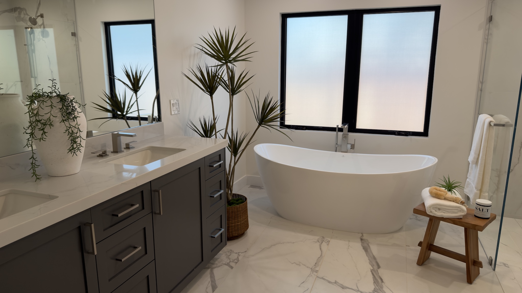 Primary bath with freestanding tub and marble floor